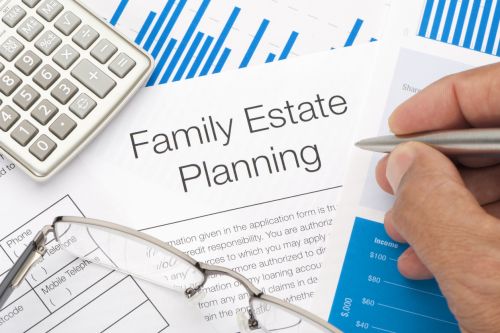 Close up of a Family Estate planning document with writing hand