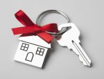 House keys with red ribbon - Gifting Your House to your Kids