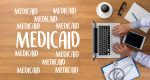 Medicaid written near a laptop and stethoscope. - Asset Protection & Elder Law of Georgia